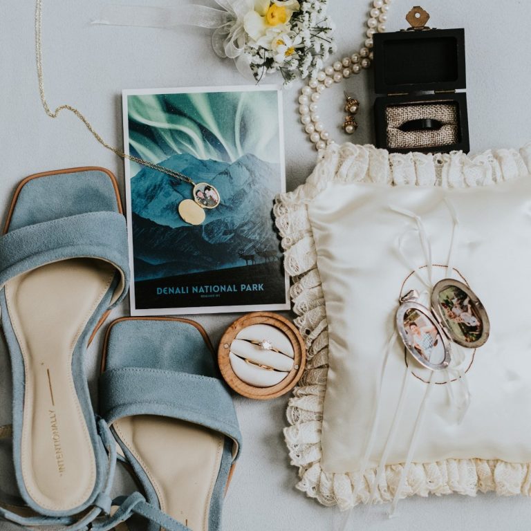 Bridal shoes, rings, jewelry, and wedding details arranged in a flat lay