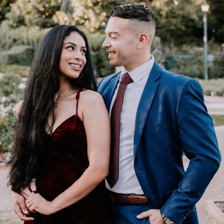 Engaged couple smiling together during a Fort Worth engagement session