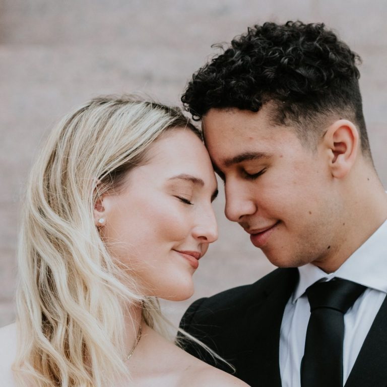 Bride and groom embracing during wedding portraits in Downtown Fort Worth